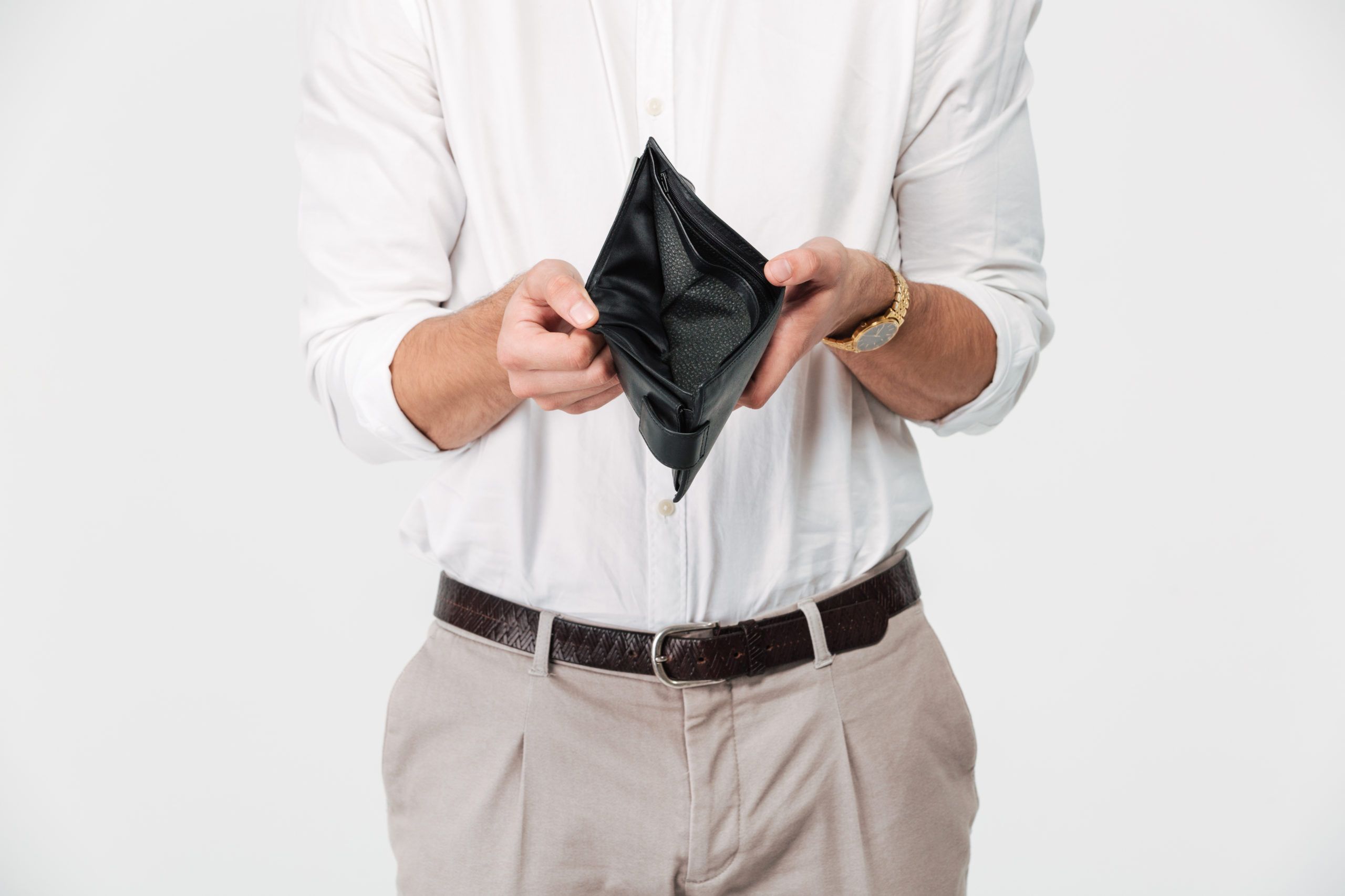 Close up portrait of a man in debt showing empty wallet