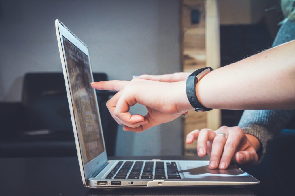 Insolvency Practitioner checking repayments on laptop