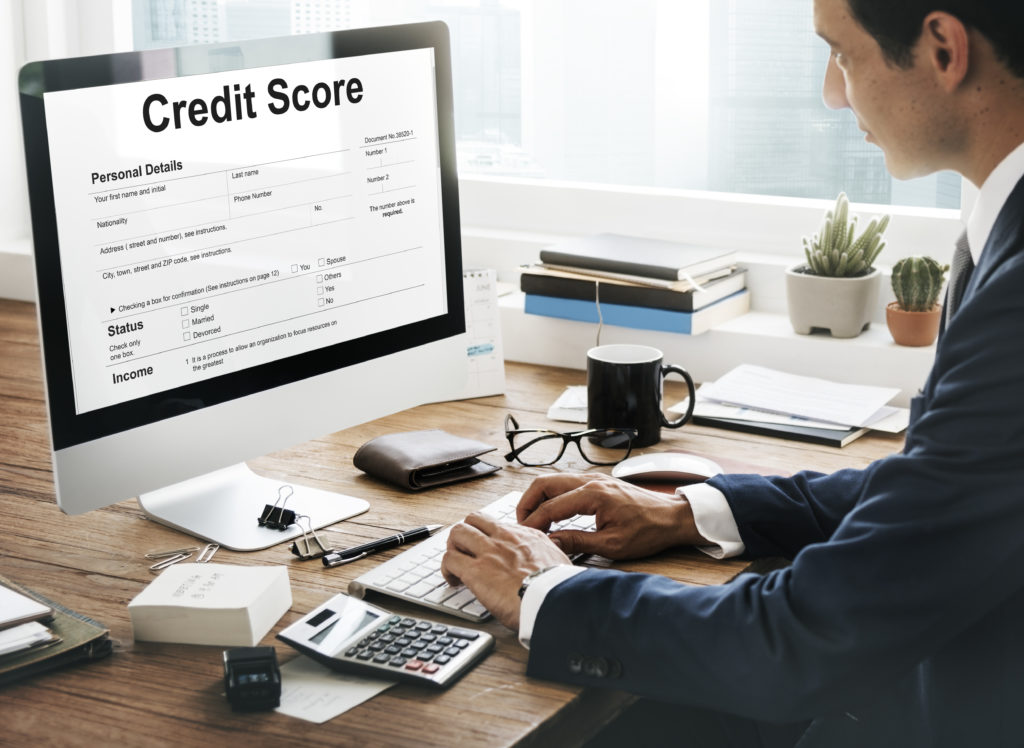 man looking at credit score